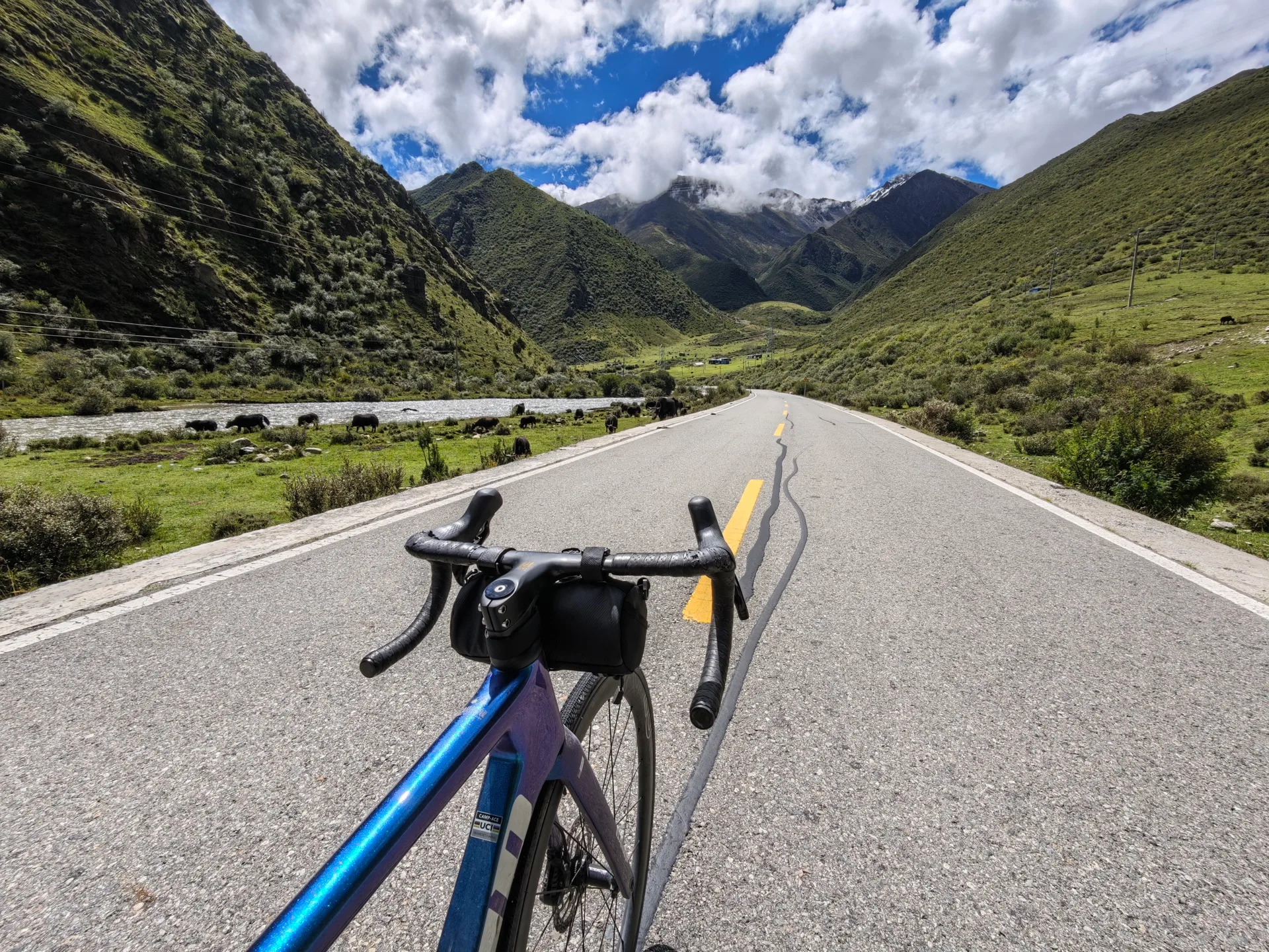 The Sichuan–Tibet Highway winding through green mountains