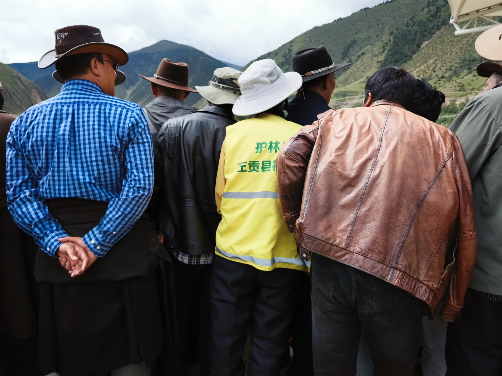 Spectators gathered beside a field at an outdoor event